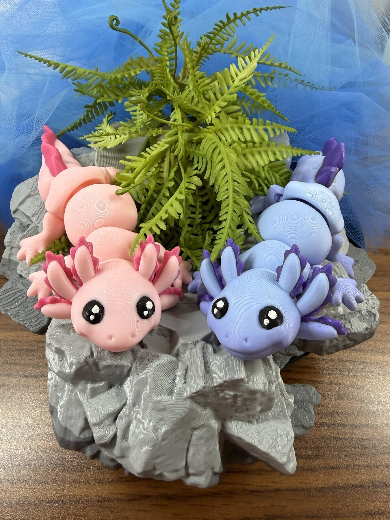 Pink and purple axolotl 3D prints made by Sensory Haven 3D